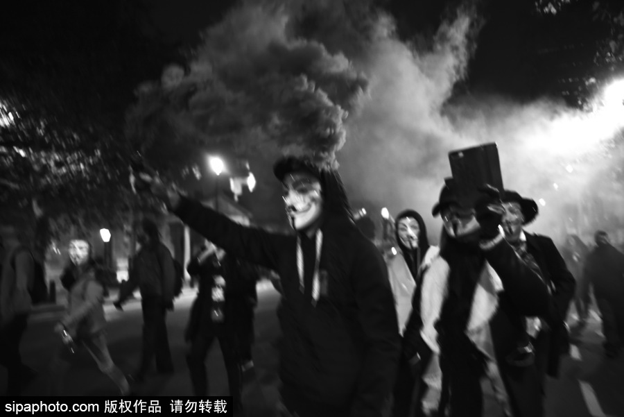 英國：蓋伊·?？怂怪暝俣热紵?！百萬面具游行在倫敦舉行
